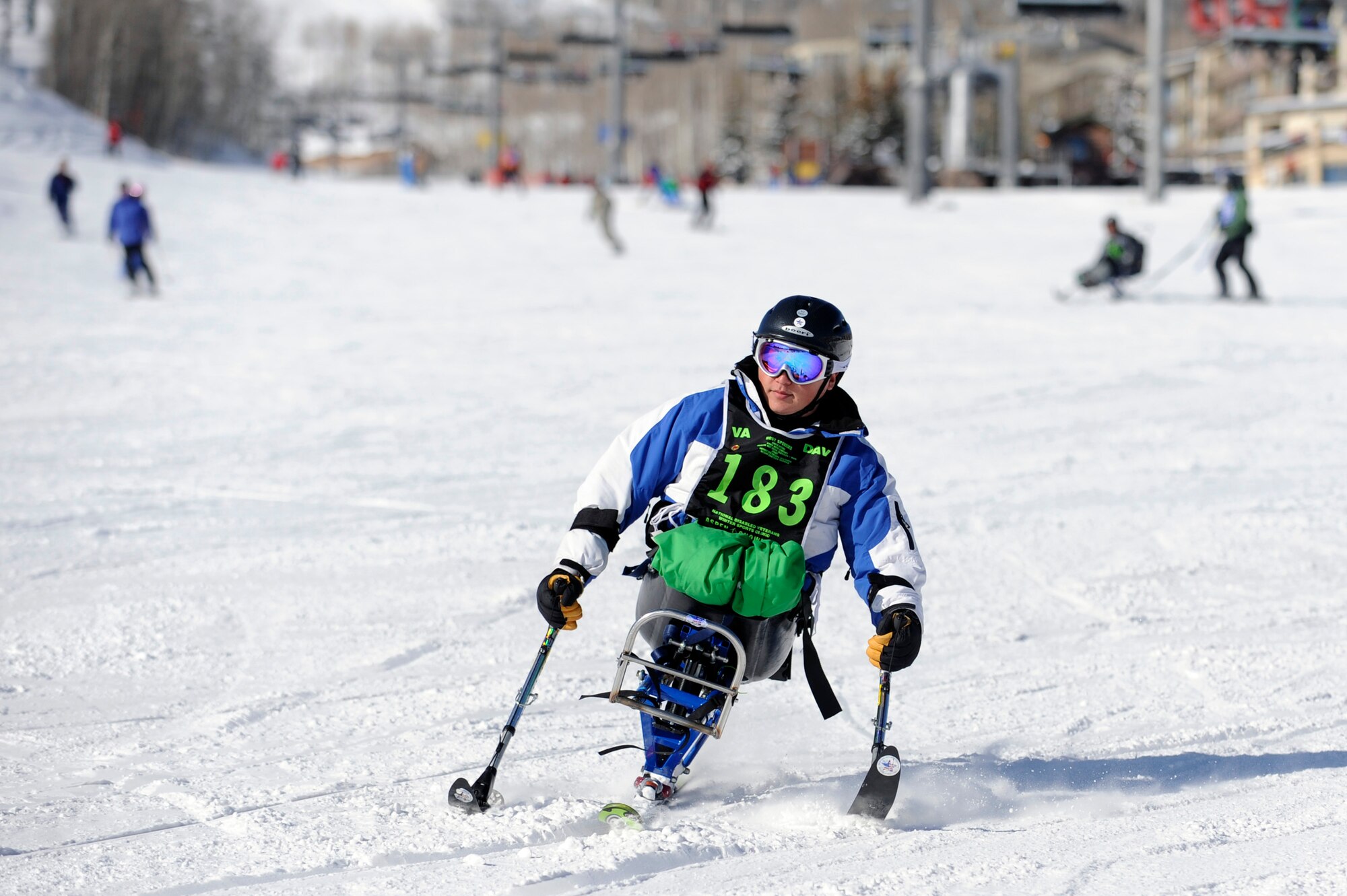 Senior Airman Kevin Krogh mono-skis Apr. 2 during the 23rd National Disabled American Veterans Winter Sports Clinic in Snowmass Village, Colo. Airman Krogh lost both legs in a major car accident in 2007 and this is his first year attending the sports clinic. Airman Krogh is assigned to Fort Sam Houston in San Antonio.  (U.S. Air Force photo/Staff Sgt. Desiree N. Palacios)