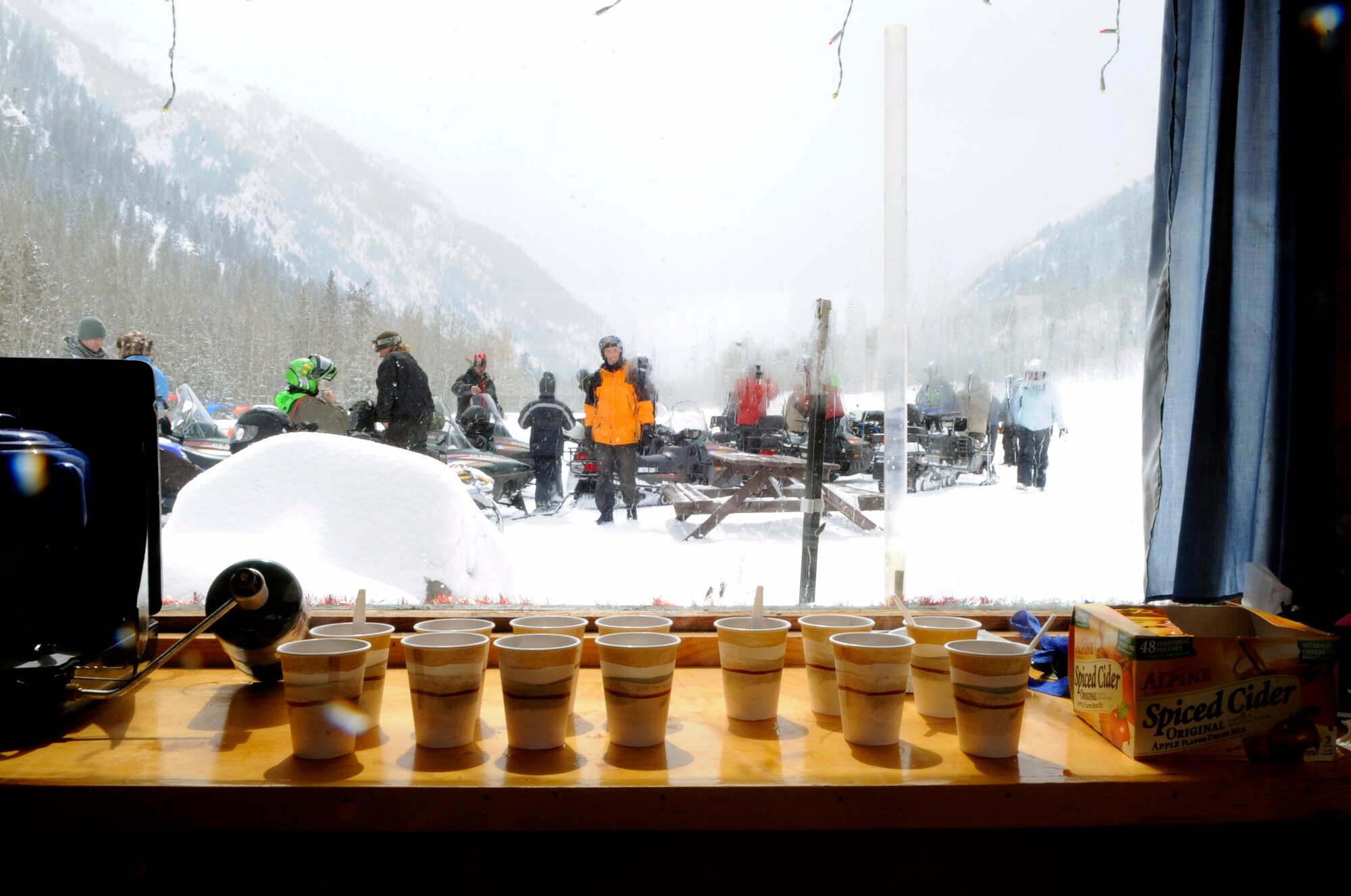 Veterans take a hot cider break after driving a snow mobile Apr. 1 during the 23rd National Disabled American Veterans Winter Sports Clinic in Snowmass Village, Colo. The six-day event that began March 28 teaches veterans with disabilities skills in adaptive Alpine and Nordic skiing, and introduces them to a number of other recreational activities and sports.  (U.S. Air Force photo/Staff Sgt. Desiree N. Palacios)