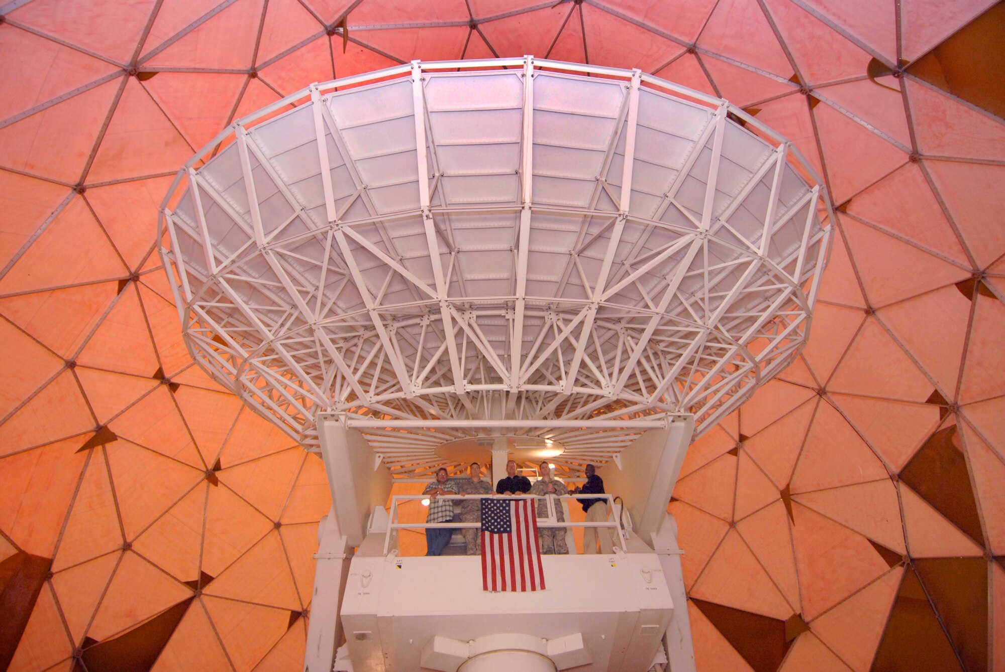 Many people are familiar with what the outside of a "golf ball" radome looks like but what is not so familiar is what's inside the radome.   The dominant piece of equipment is a 38 foot antenna which makes up the largest part of the OE-222 Antenna Group.  This equipment is used to transmit and receive RF signals to and from various communication satellites out in space.   The 379th Expeditionary Communications Squadron Satellite Communications work center operates and maintains the equipment at an undisclosed location in Southwest Asia, Mar. 30, 2009, in support of Operations Iraqi and Enduring Freedom and Combined Joint Task Force - Horn of Africa.  (U.S. Air Force photo/Senior Airman Andrew Satran/released)    
