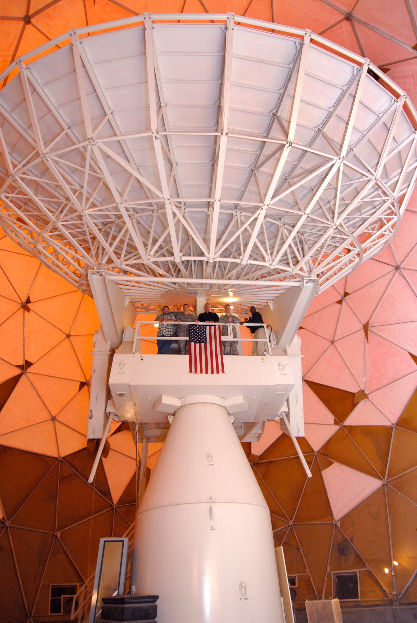 Many people are familiar with what the outside of a "golf ball" radome looks like but what is not so familiar is what's inside the radome.   The dominant piece of equipment is a 38 foot antenna which makes up the largest part of the OE-222 Antenna Group.  This equipment is used to transmit and receive RF signals to and from various communication satellites out in space.   The 379th Expeditionary Communications Squadron Satellite Communications work center operates and maintains the equipment at an undisclosed location in Southwest Asia, Mar. 30, 2009, in support of Operations Iraqi and Enduring Freedom and Combined Joint Task Force - Horn of Africa.  (U.S. Air Force photo/Senior Airman Andrew Satran/released)    