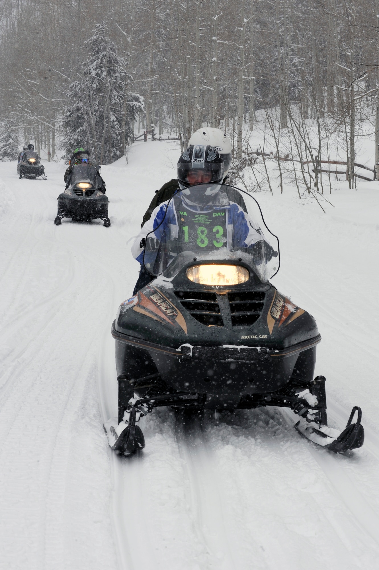 Senior Airman Kevin Krogh drives a snowmobile Apr. 1 during the 23rd National Disabled American Veterans Winter Sports Clinic in Snowmass Village, Colo. Airman Krogh lost both legs in a major car accident in 2007 and this is his first year attending the sports clinic. Airman Krogh is assigned to Fort Sam Houston in San Antonio.  (U.S. Air Force photo/Staff Sgt. Desiree N. Palacios)
