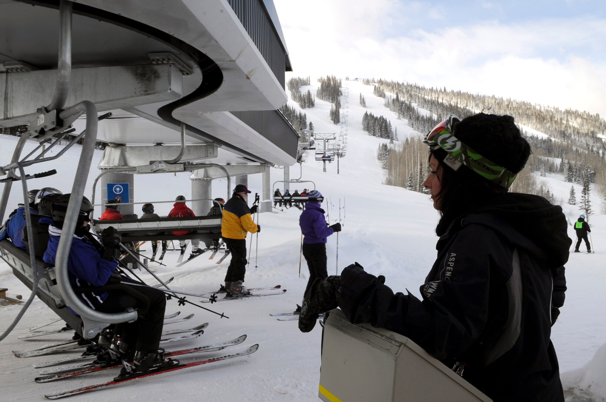 Veterans and people from all over the world ride the ski lift to Sam's Knob Mar. 31 during the 23rd National Disabled American Veterans Winter Sports Clinic in Snowmass Village, Colo.  (U.S. Air Force photo/Staff Sgt. Desiree N. Palacios)