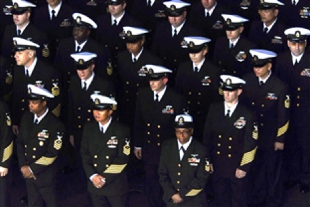 U.S. Navy Chief Petty Officers stand in formation before a sea burial aboard the aircraft carrier USS John C. Stennis in the Pacific Ocean, April 1, 2009. John C. Stennis is on a scheduled six-month deployment to the western Pacific Ocean.