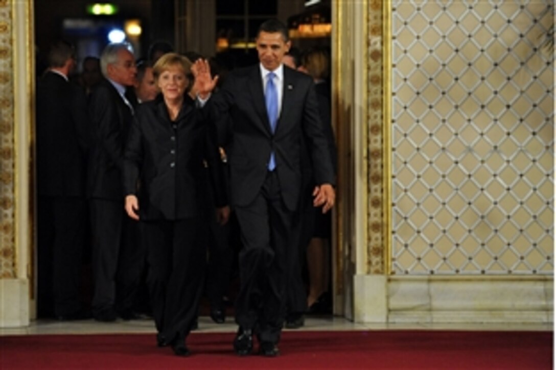Angela Merkel, chancellor of the Federal Republic of Germany and Barack Obama, U.S. president, walk together following a working dinner April 3, 2009, at NATO's 60th anniversary summit in Strasbourg, France.