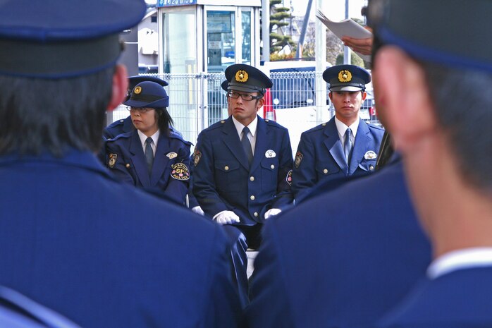 Officers of the newly founded Safety Patrol Iwakuni look on during the opening ceremony of Iwakuni’s new police substation, Kowashima Koban, near four corners in Iwakuni April 3. The safety patrol was designed to improve communication between base personnel and local nationals.