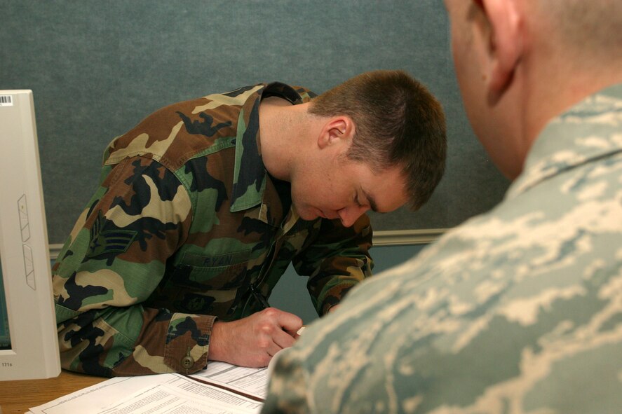 Senior Airman Daniel Ryan, a Load Planner with the 67th Aerial Port Squadron processes through the deployment line in preparation for a deployment to Iraq. 40 Members from the 67th will spend more than 120 days processing military personnel and cargo. (U.S. Air Force photo/Staff Sgt. Kyle Brasier)