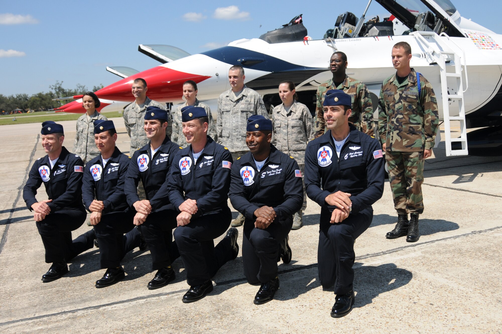 Seven Keesler Airmen reenlisted alongside one of the F-16 Thunderbirds March 3 in advance of the the Thunder on the Bay Air Show March 4-5.  The Thunderbirds are making their first air show appearance at Keesler since 1995.  It’s Keesler’s first air show in five years.  (U.S. Air force photo by Kemberly Groue)