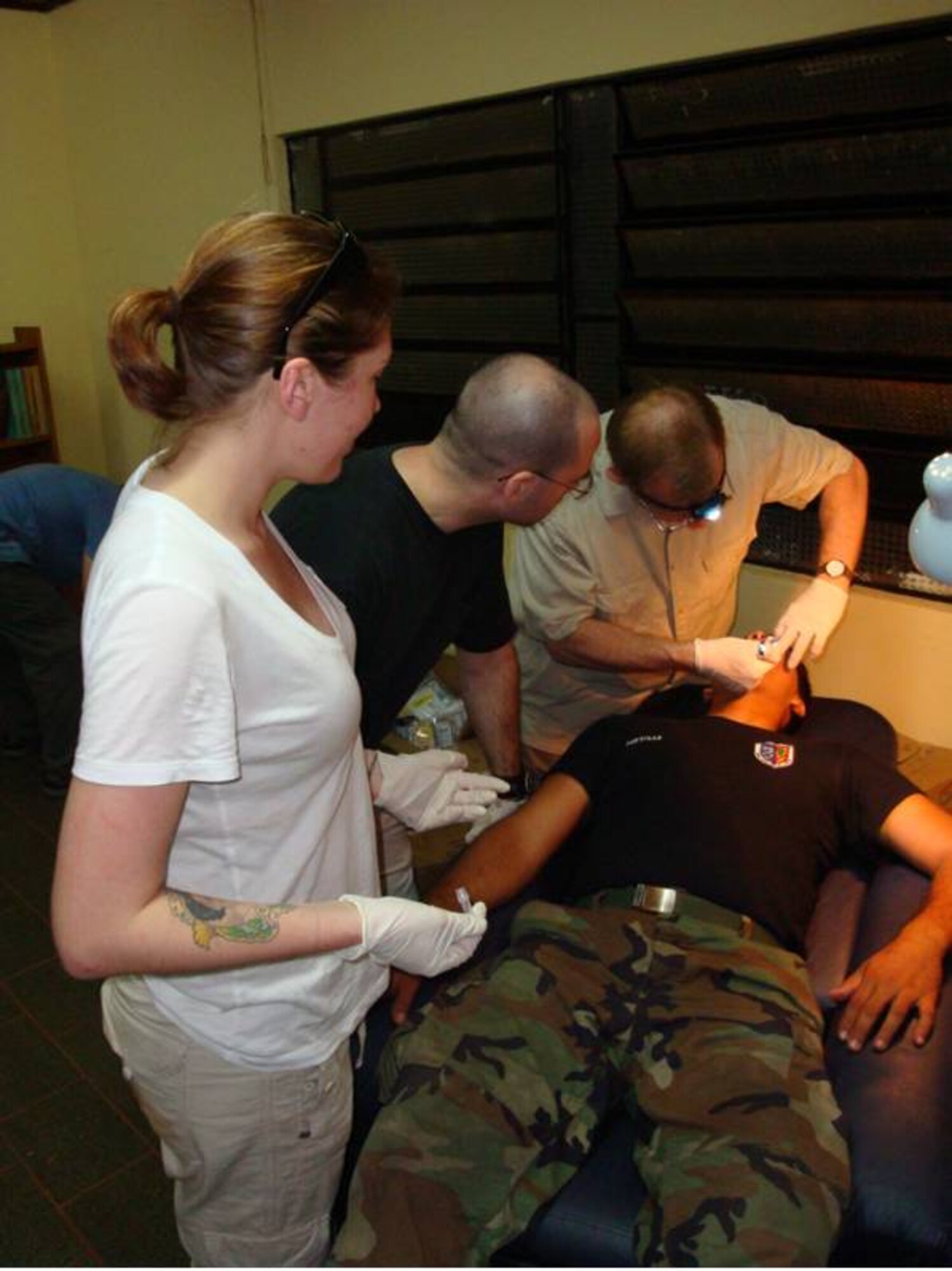 Lt. Col. Rockwell demonstrates the exam for onlookers 
