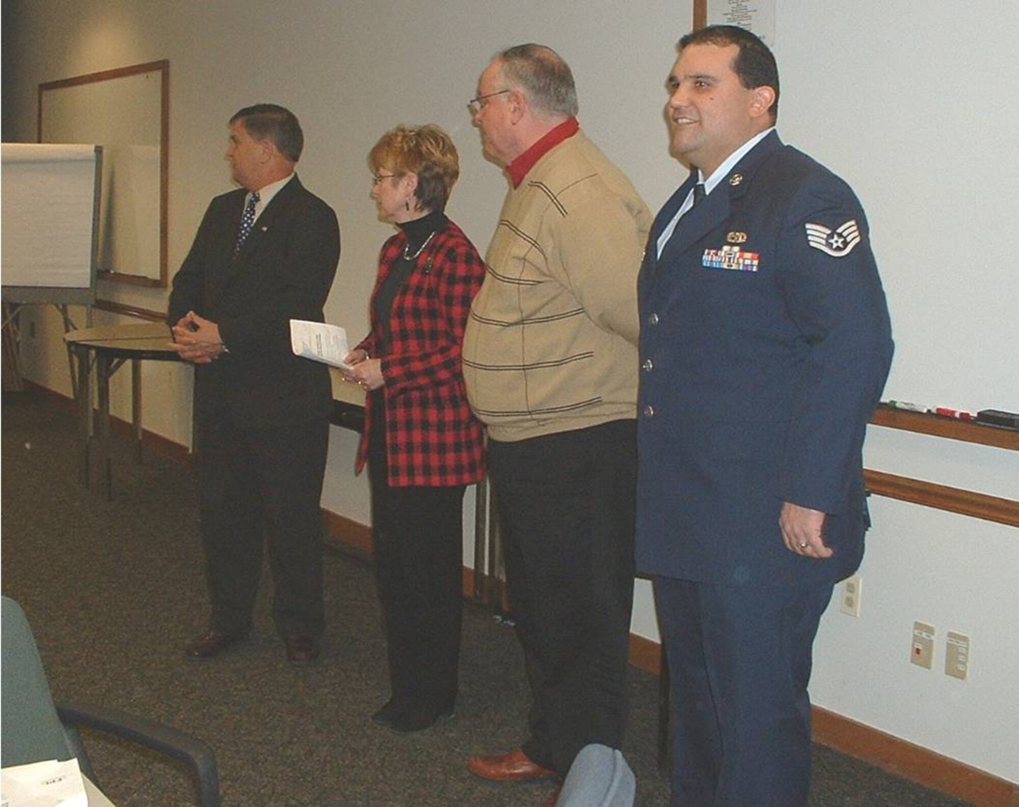 Earl Bonett, MA ESGR Area Chair and Ombudsman Director, Claude Waterman, Vice President of Human Resources, Thomas J. Moran, President & CEO, and SSgt Victor Rolon.