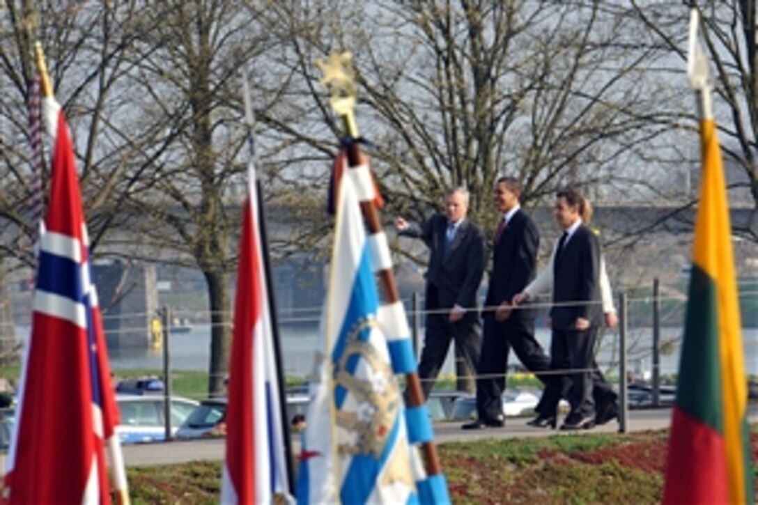 NATO Secretary Jaap de Hoop Scheffer,  U.S. President Barack H. Obama and French President Nicolas Sarkozy participate in ceremonies on the banks of  the Rhine River, April 4, 2009, during the 60th anniversary of the formation of the security alliance. 