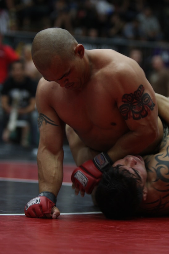 Welterweight Fight Club 29 team member James Clark pins his opponent from Marine Corps Base Camp Pendlton, Calif., team during the California State Pankration Championships in Santa Ana, Calif., Sunday.