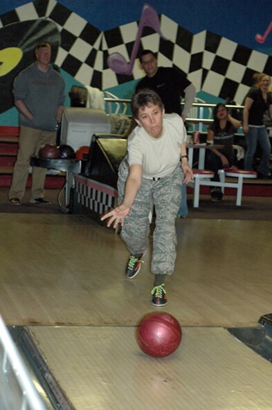 Senior Master Sgt. Ann Kurth lets loose another ball during the 302nd Airlift Wing's Seventh Annual Bowling Tournament April 4. Sergeant Kurth's team "Spare Me" was one of the dozens competing for bragging rights and a trophy at Classic Bowl in Colorado Springs, Colo. The 302nd Maintenance Group's maintenance team came out on top this year. (U.S. Air Force photo/Tech. Sgt. Daniel Butterfield)