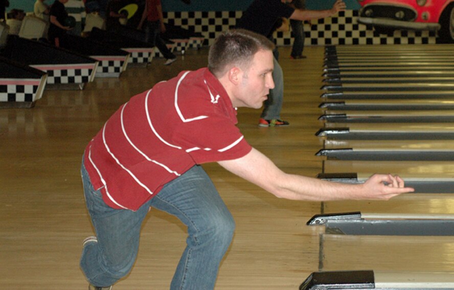 Tech. Sgt. Richard Normandie, 302nd Airlift Wing, follows through during the wing's Seventh Annual Bowling Tournament. Sergeant Normandie and his team "The Equalizers" competed against dozens of Airmen April 4 at Classic Bowl in Colorado Springs, Colo. The 302nd Maintenance Group's maintenance team came out on top this year. (U.S. Air Force photo/Tech. Sgt. Daniel Butterfield)