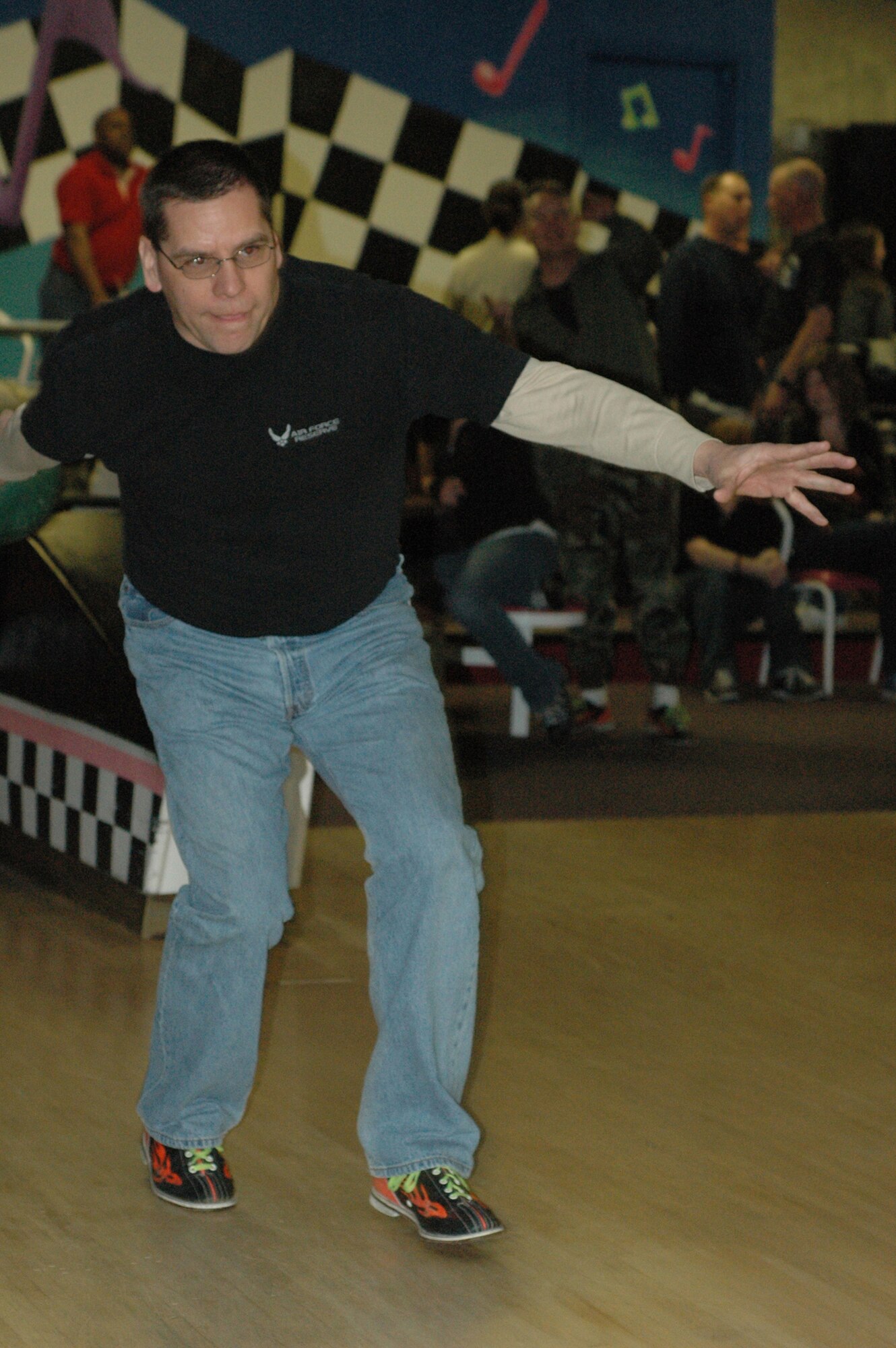 Senior Master Sgt. Tony Garcia hopes for a strike during the 302nd Airlift Wing's Seventh Annual Bowling Tournament April 4 in Colorado Springs, Colo. Sergeant Garcia, 302nd Mission Support Flight's Chief of Employment and his team "Dust Wun" joined dozens of Airmen in competing for bragging rights and a trophy. "I really enjoy the camaraderie, and hanging out with people outside of the office," said Staff Sgt. Joe Platt, another member of the team. The maintenance team won the tournament. (U.S. Air Force photo/Tech. Sgt. Daniel Butterfield)
