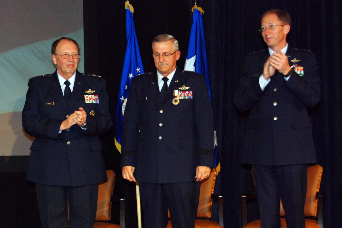 ATLANTA -- Maj. Gen. Martin M. Mazick, center, recieves applause April 4 at the 22nd Air Force Senior Leaders Conference 2009 after being awarded the Distinguished Service Medal for his meritorious service as commander, 22nd Air Force, from 2006 to 2009. After General Mazick was awarded the medal by Lt. Gen. Charles E. Stenner Jr., commander, Air Force Reserve Command, left, Maj. Gen. James T. Rubeor, right, assumed command of 22nd Air Force, coming from his position as deputy to the chief of Air Force Reserve, Headquarters U.S. Air Force Reserve, Washington D.C. (U.S. Air Force photo/2nd Lt. Joe Simms)