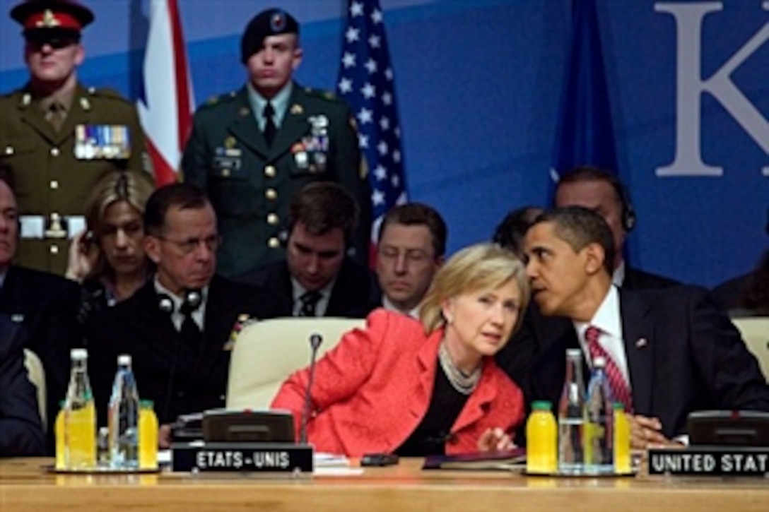President Barack Obama confers with Secretary of State Hillary Rodham Clinton during the NATO summit in Strasbourg, France, April 4, 2009. The international security alliance marked its 60th anniversary this weekend, welcoming Croatia and Albania as new members and pledging to contribute some 5,000 more personnel to Afghanistan .
