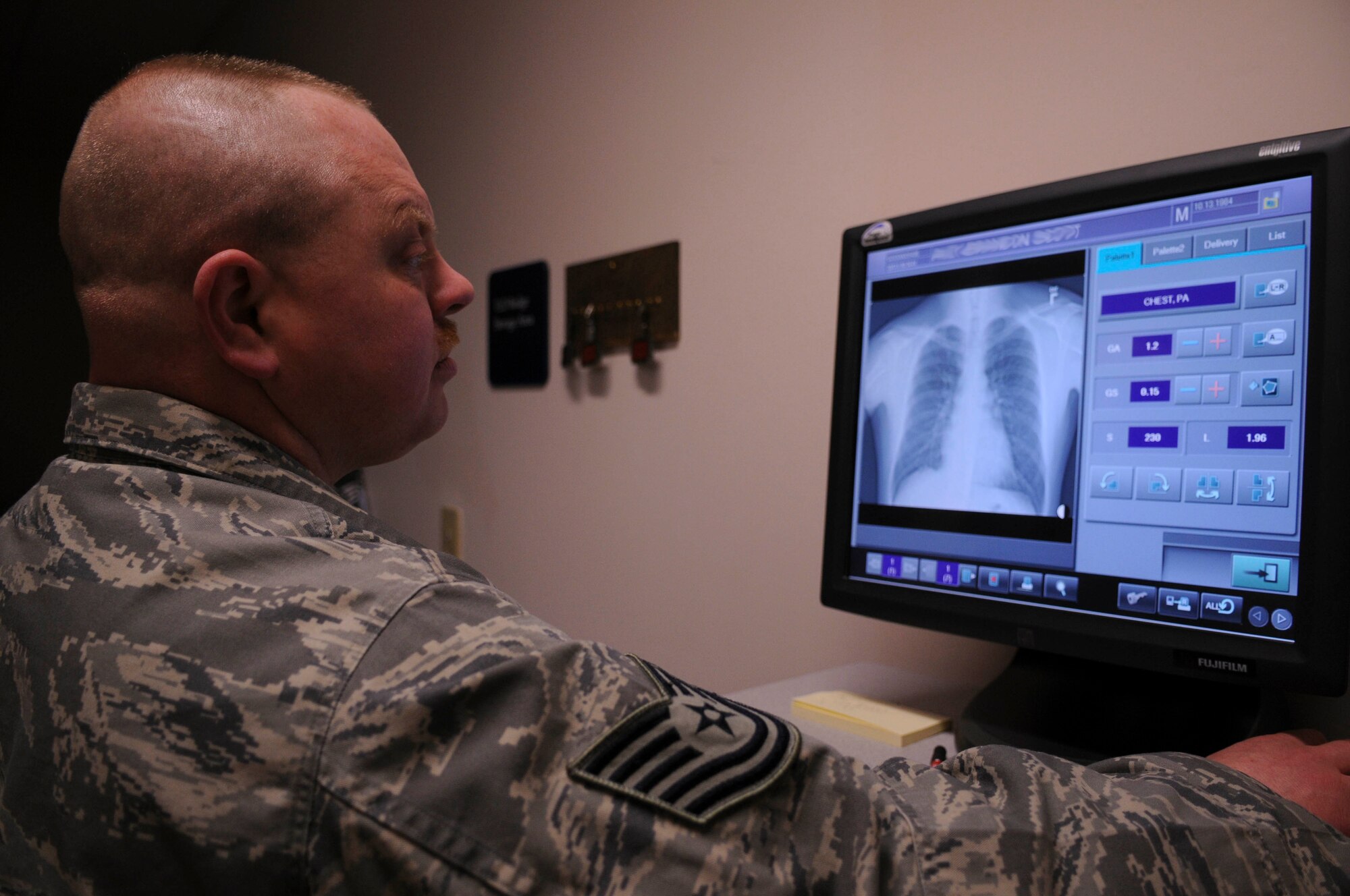 Tech. Sgt. Christopher Ledgett views a chest X-ray April 2, 2009, Eielson Air Force Base, Alaska. The 354th Medical Group now digitally processes X-rays, which can be e-mailed, saving time and money compared to older methods. Sergeant Ledgett is the NCO in charge of diagnostic imaging, 354th MDG. (U.S. Air Force photo/Airman 1st Class Laura Max)

