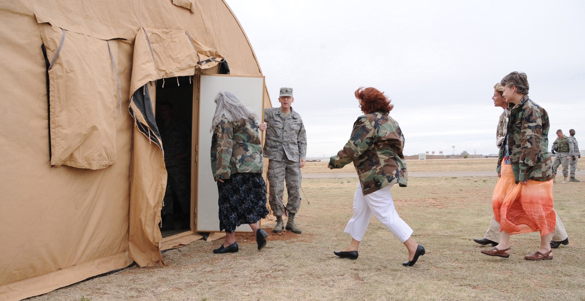 CANNON AIR FORCE BASE, N.M.--Teachers from Clovis, N.M. elementary schools arrive at Camp TUDOS, a simulated deployed location here April 1 for briefings by medical, family advocacy, and Airmen & Family Readiness Center personnel. The Teachers Understanding Deployment Operations exercise simulated many situations Airmen and their children experience during deployments to give teachers more insight in the classroom. (U.S. Air Force photo by Airman 1st Class Maynelinne De La Cruz)