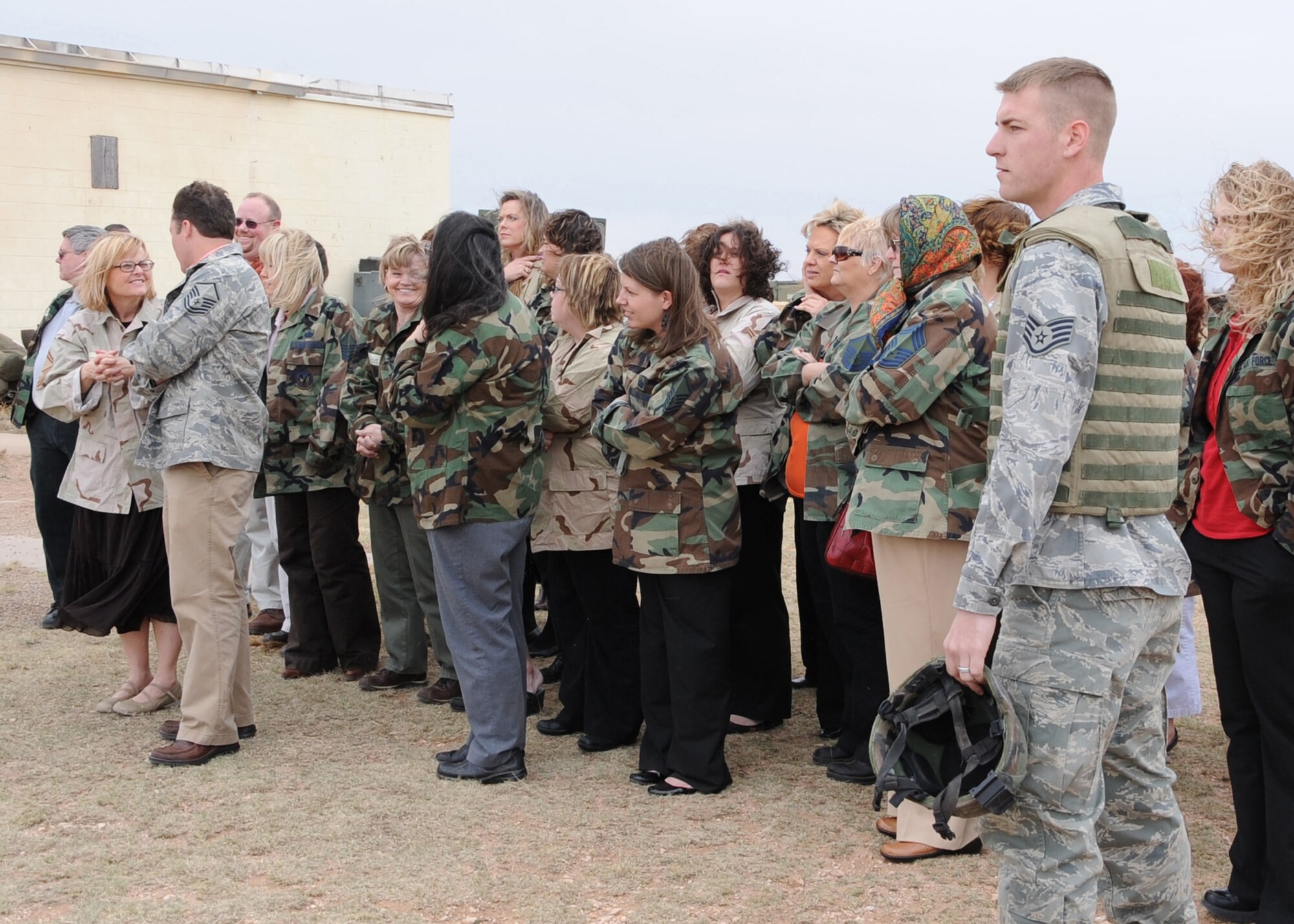 CANNON AIR FORCE BASE, N.M. -- Teachers and Airmen witness a simulated attack on American forces as they hear simulated bombs explode during the Teachers Understanding Deployed Operations program April 1. The simulated scenario gave teachers a better understanding of what children at school who have deployed parents are going through. (U.S. Air Force photo by Airman 1st Class Maynelinne De La Cruz)