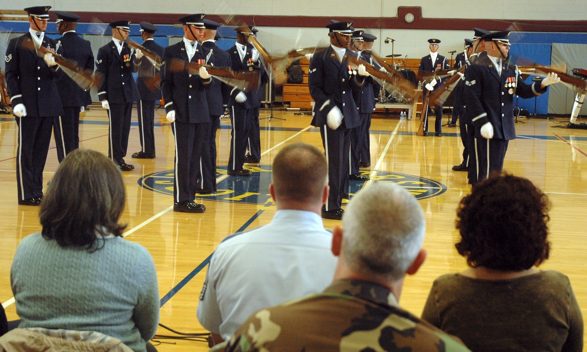 The U.S. Air Force Honor Guard Drill Team performs March 31 at Maxwell AFB, Montgomery, Ala. The U.S. Air Force Honor Guard Drill Team and the U.S. Air Force Band Max Impact joined forces for the first time to showcase their skills in two joint performances in the Southeast region. About 300 elementary school children, base Airmen and leadership from Maxwell and Bolling AFB were on hand. (U.S. Air Force photo by Senior Airman R. Michael Longoria)