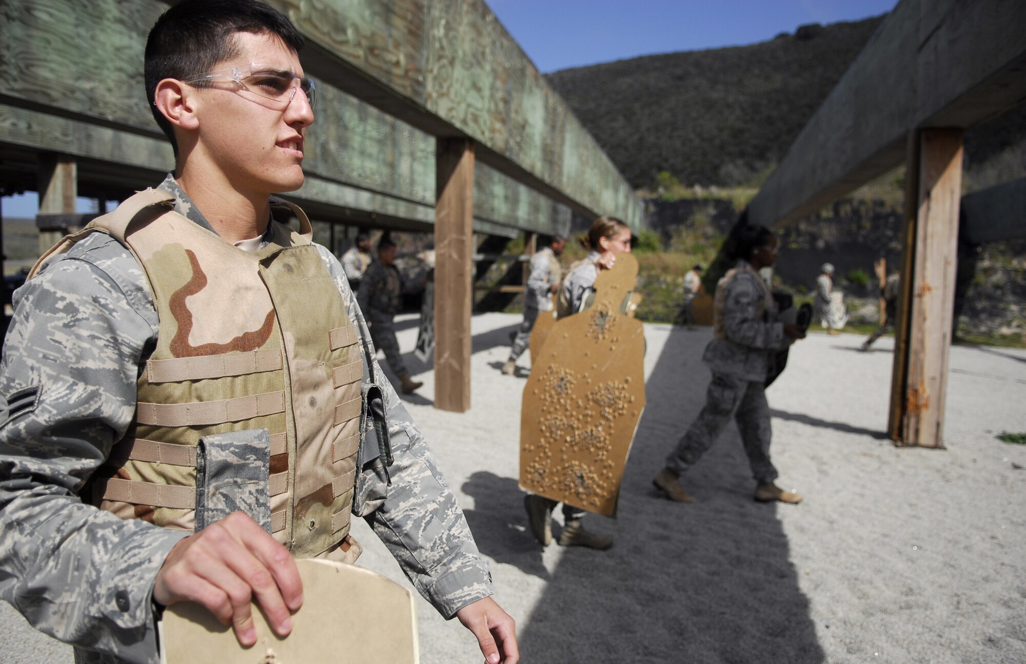VANDENBERG AIR FORCE BASE, Calif.-- Targets prepared, Airmen of the 30th Security Forces Squadron move down range to post them during M4 Rifle Training April 2 at the firing range here. The 30th SFS Combat Arms Training and Maintenance team trains hundreds of Vandenberg Airmen in a variety of weapons for deployment and recurring qualification.  (U.S. Air Force photo/Senior Airman Christopher Hubenthal)