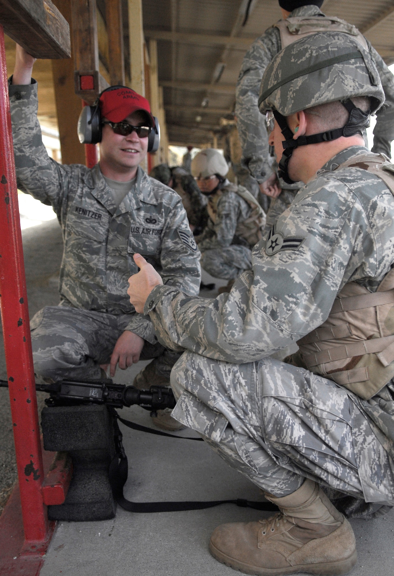 VANDENBERG AIR FORCE BASE, Calif.-- Staff Sgt. Mike Kenitzer, a 30th Security Forces Squadron combat arms instructor, helps Airmen site their weapons April 2 during M4 Rifle training at the firing range here. The 30th SFS Combat Arms Training and Maintenance team trains hundreds of Vandenberg Airmen in a variety of weapons for deployment and recurring qualification.  (U.S. Air Force photo/Senior Airman Christopher Hubenthal)