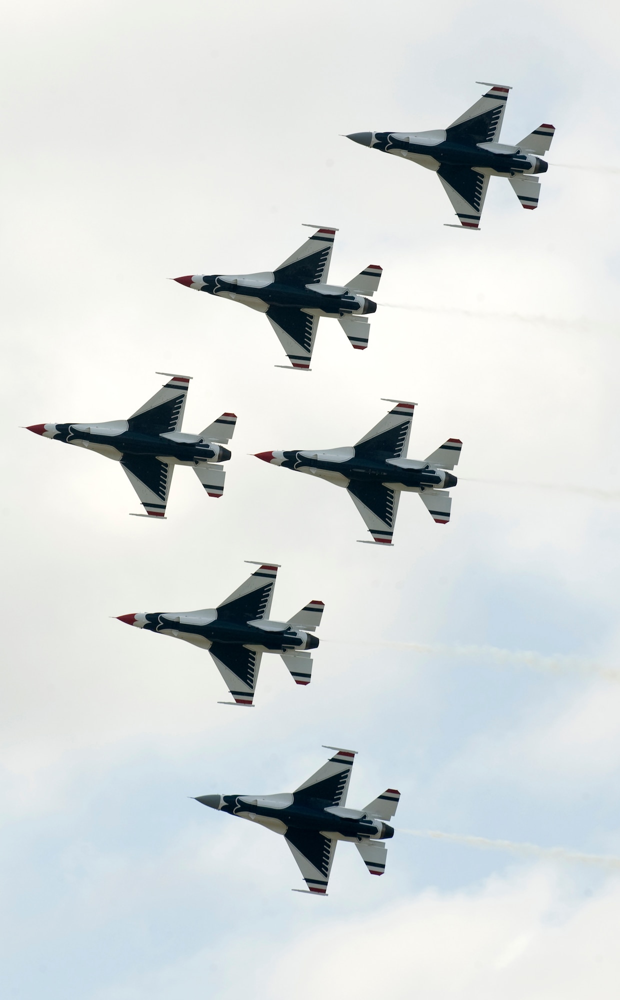 The Thunderbird solo aircraft (at the top and bottom of the formation featuring gray radomes) join up with the Thunderbirds diamond formation to build the six-ship delta formation April 4 at Keesler Air Force Base, Miss. (U.S. Air Force photo/Staff Sgt. Kristi Machado) 
