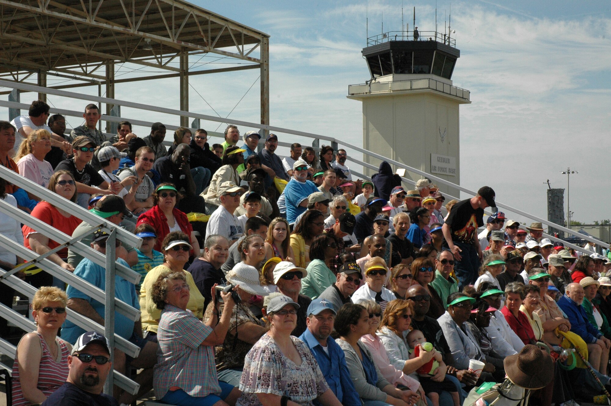 Crowds of people filled the bleachers and the runway at Keesler Air Force Base for the 2009 Keesler Air Show, dubbed Thunder on the Bay. Saturday saw recording-breaking crowds of more than 85,000 onlookers. The hazy weather during the first half on the day probably contributed to the smaller crowd on Sunday, but thankfully the weather cleared up enough toward the end of the day for the Thunderbirds to put on a spectacular show.