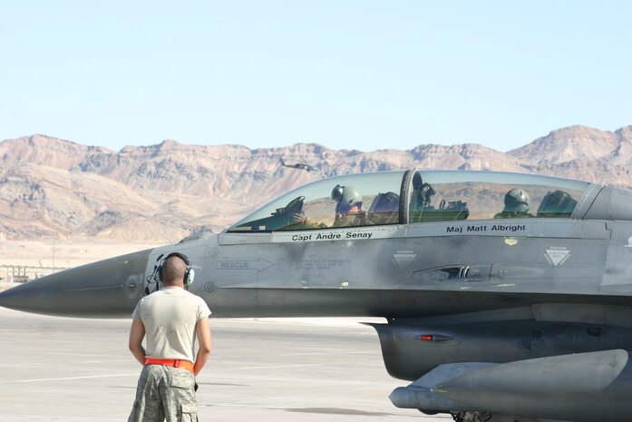A fighter pilot from the 23rd Fighter Squadron, Spangdahlem Air Base, Germany conducts final pre-flight checks before conducting a close air support mission during GFW 09-05 at Nellis AFB, Nev. (Photo: Casey Bain, JFIIT, USJFCOM)
