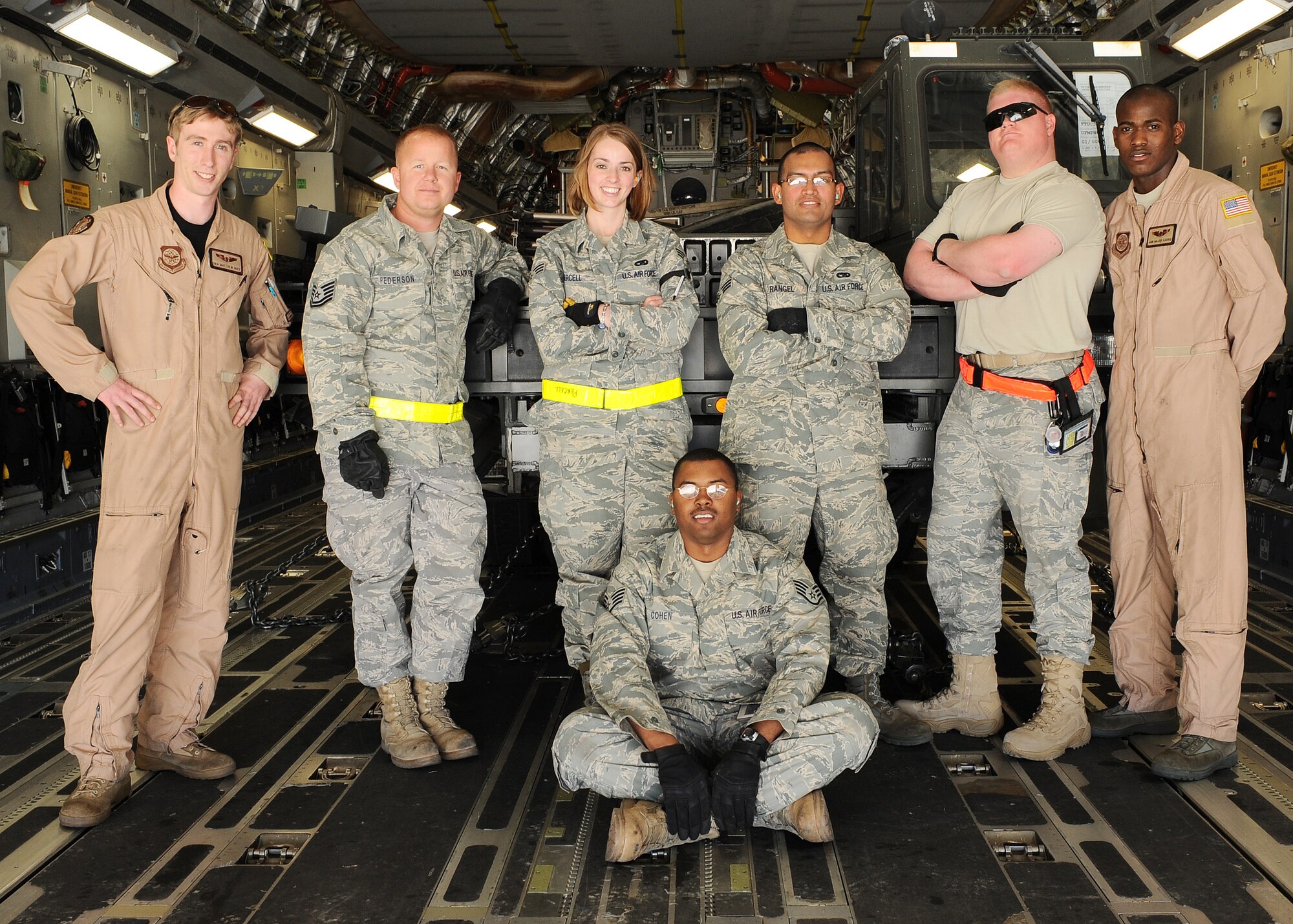 Members from the 49th Logistics Readiness Squadron load team pose for a group photo with the loadmasters of the C-17 from McChord Air Force Base, Wash., after loading a 60,000 pound aircraft loader at Holloman Air Force Base, N.M., March 3. The loader is being deployed to CENTAF to assist with cargo operations in the AOR. (U.S. Air Force photo/ Airman 1st Class DeAndre Curtiss)