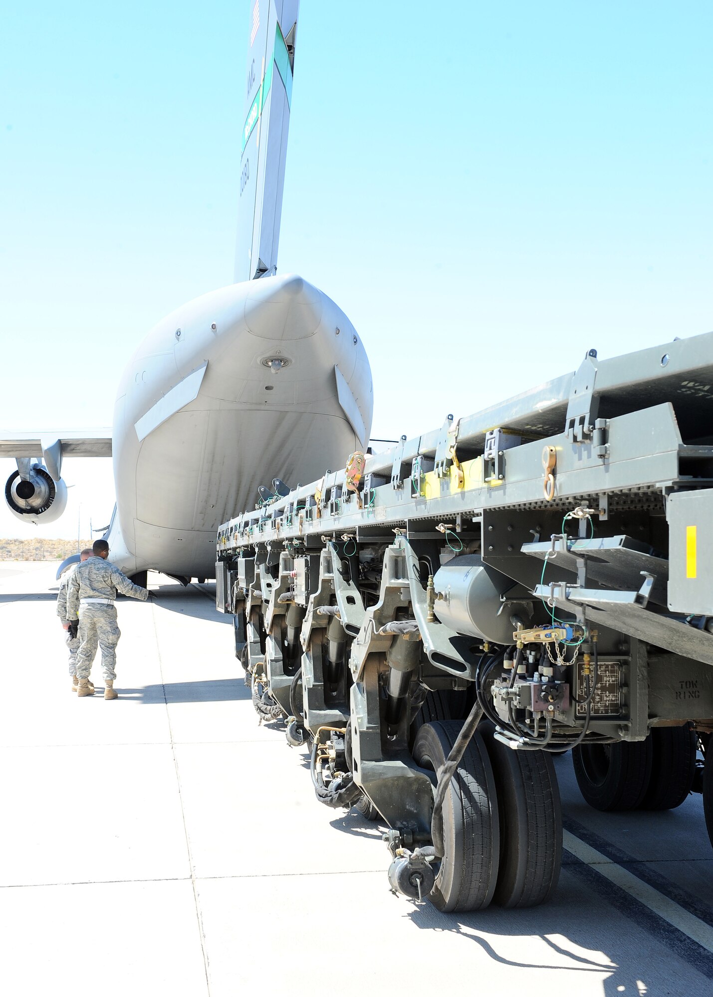 Members of the 49th Logistics Readiness Squadron load a 60,000 pond aircraft loader onto a C-17 from McChord Air Force Base, Wash., here on Holloman Air Force Base, N.M., March 3. The aircraft loader is being deployed to CENTAF to assist with cargo operations in the AOR. (U.S. Air Force photo/ Airman 1st Class DeAndre Curtiss)