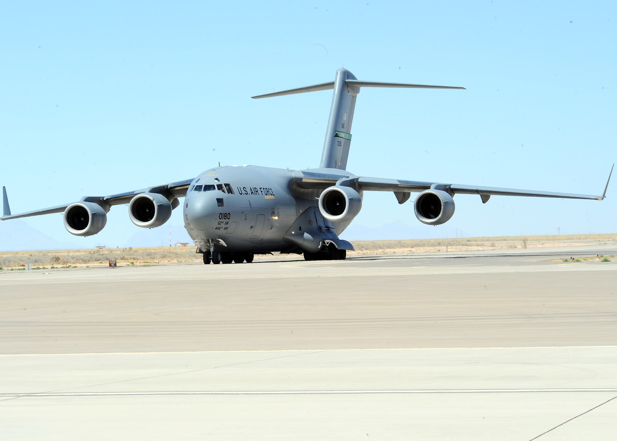 A C-17 from McChord Air Force Base Wash., taxies into Holloman Air Force Base, N.M., March 3. The C-17 was here to pick up a 60,000 pound aircraft loader that is being deployed to CENTAF to assist with cargo operations in the AOR. (U.S. Air Force photo/ Airman 1st Class DeAndre Curtiss)