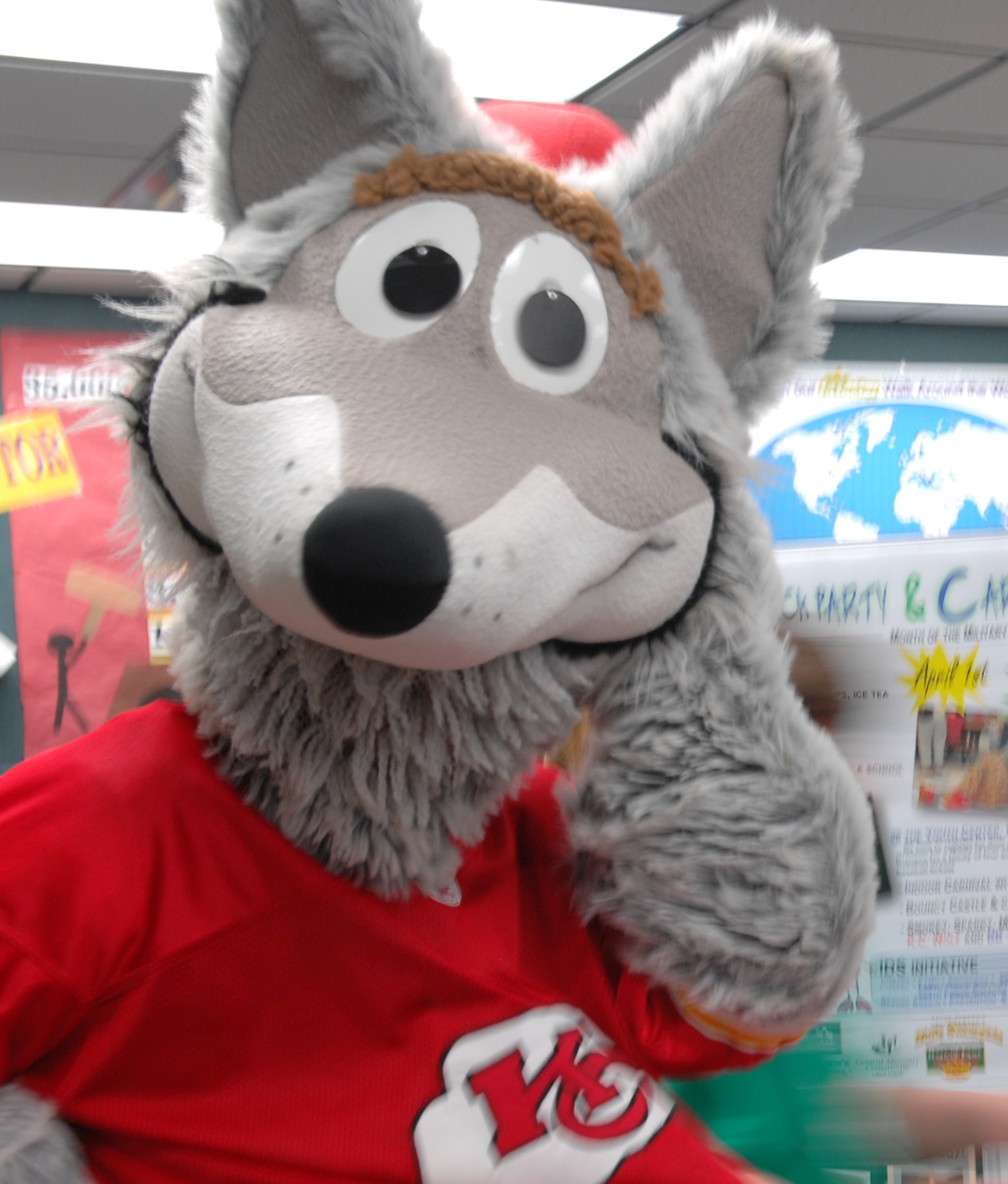 WHITEMAN AIR FORCE BASE, Mo. – K.C. Wolf, Kansas City Chiefs mascot strikes a pose at the block party in Whiteman’s youth center April 1. The event, held at the base chapel and youth center, included free food, an indoor carnival, praise band and information fair. (U.S. Air Force Photo by Staff Sgt. Bryan Vandersommen)