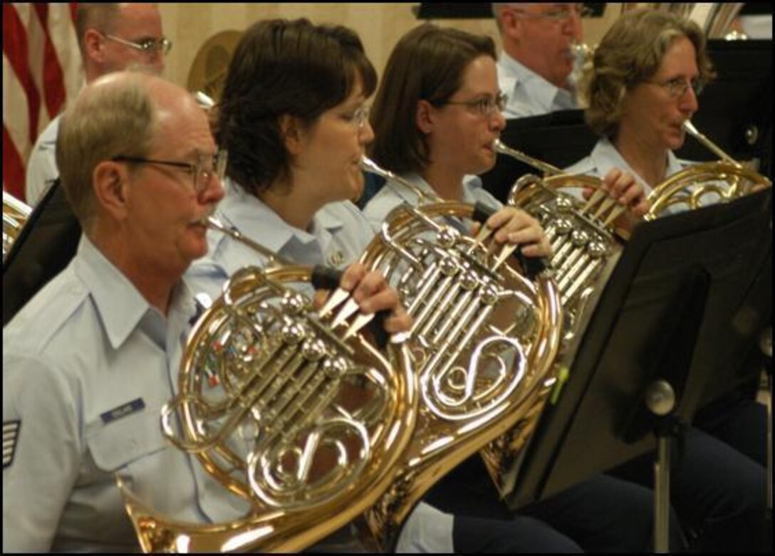 The Air National Band of the Smoky Mountains Horn Section performs during a concert at a VA hospital.