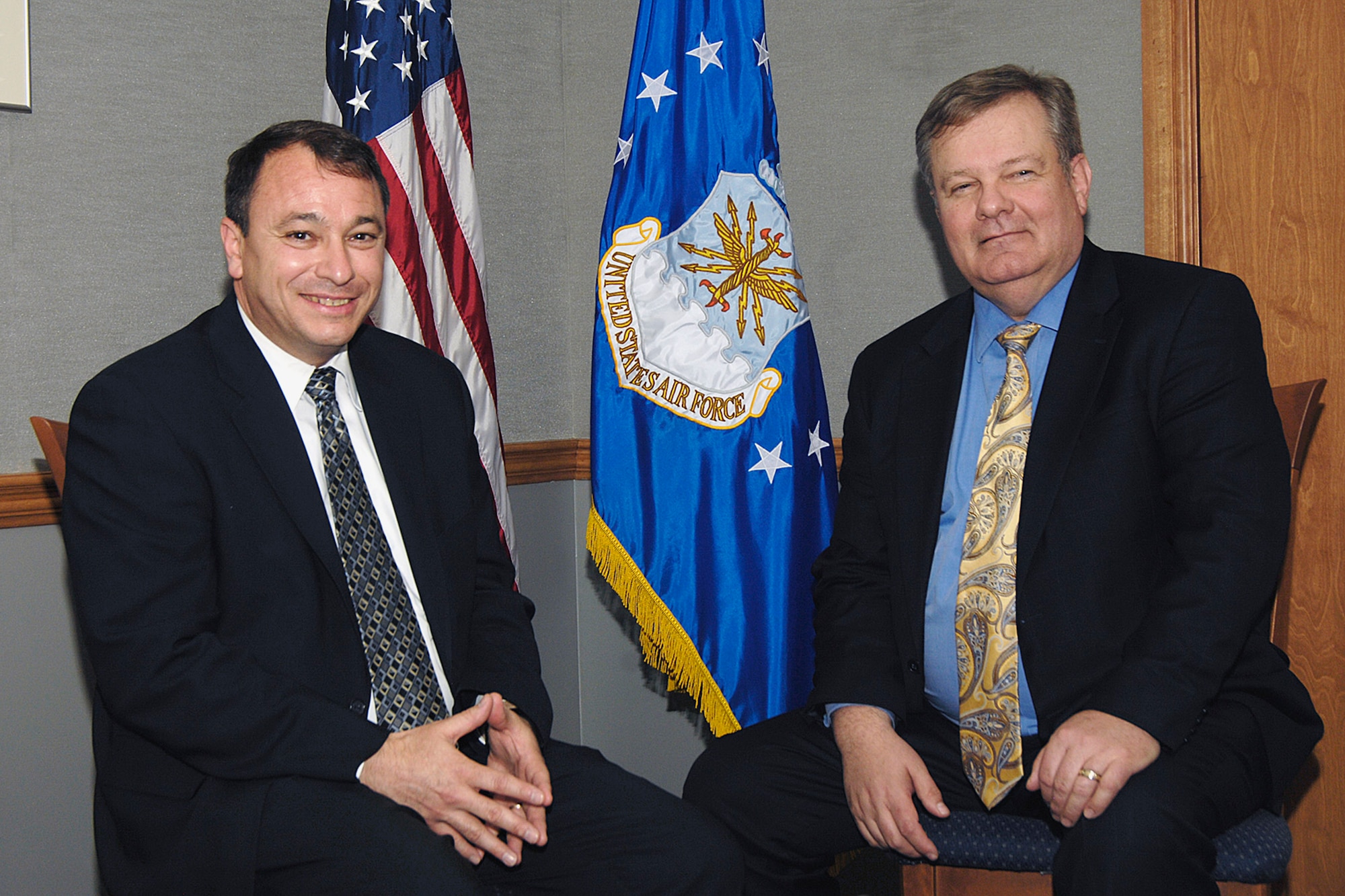 Ronald Poussard (left), director of Air Force small business programs, and David Van Buren, principal deputy assistant secretary of the Air Force for acquisition, discuss the importance of small business during a joint interview April 2 at Hanscom Air Force Base, Mass.  (U.S. Air Force photo/Linda LaBonte Britt) 