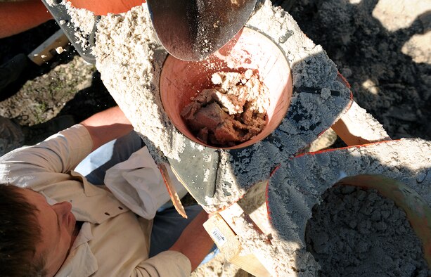 MOODY AIR FORCE BASE, Ga. -- Ken Spears, 23rd Civil Engineer Squadron director of emergency management, fills a sand bag using an inverted road cone at the Valdosta Wastewater Treatment Plant April 3. Members from the 23rd CES were called to help prevent flood damage to the plant that would have caused a loss of sanitation services to more than 18,00 local residents. (U.S. Air Force photo by Airman Joshua Green) 



