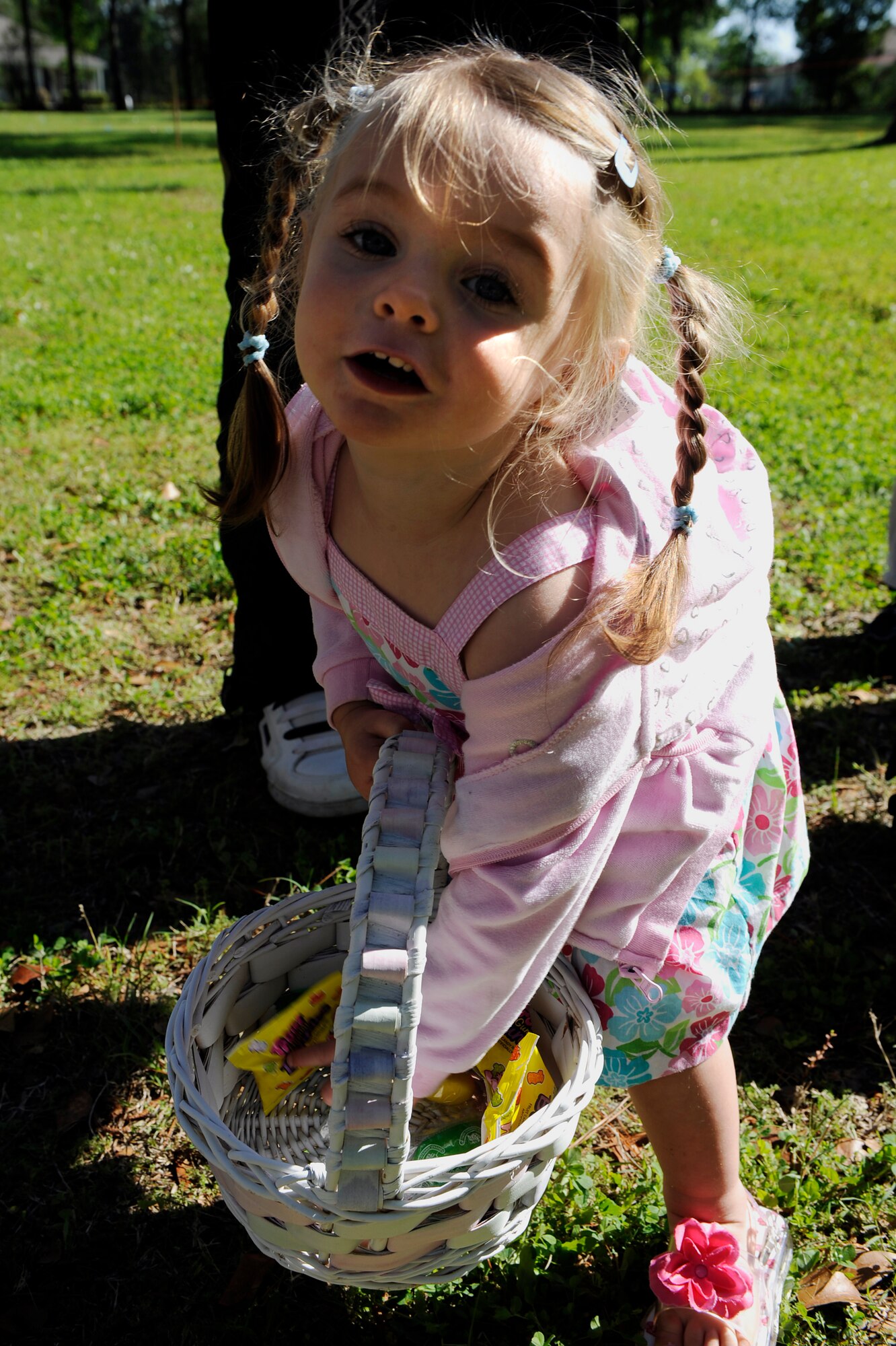 MOODY AIR FORCE BASE, Ga. -- Lilly Barker, 2-year-old daughter of Senior Airman Brittany Barker, shows off her collection of treats during an Easter egg hunt here April 4. (U.S. Air Force photo by Senior Airman Brittany Barker)


