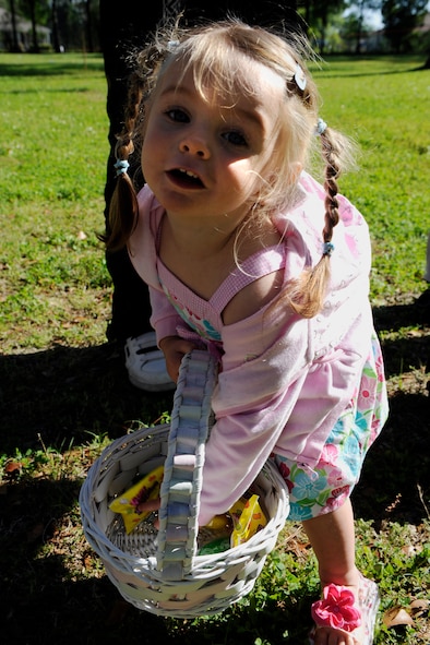 MOODY AIR FORCE BASE, Ga. -- Lilly Barker, 2-year-old daughter of Senior Airman Brittany Barker, shows off her collection of treats during an Easter egg hunt here April 4. (U.S. Air Force photo by Senior Airman Brittany Barker)


