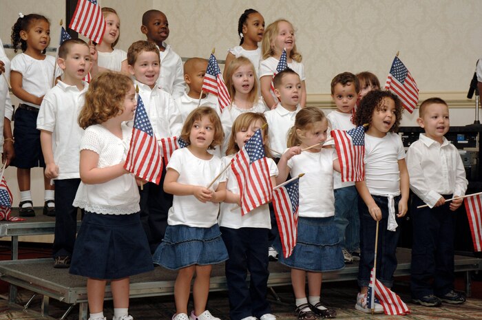 Children from the Brig. Gen. Thomas R.  Mikolajcik Child Development Center sing during the 2nd Annual Joint Community Proclamation Signing Ceremony at the Charleston Club April 2. The signing of the proclamation continues collaboration with local communities and military installations for prevention of sexual assault and child abuse. Representatives from six nearby communities, along with the Naval Weapons Station Charleston, joined Charleston AFB in signing the proclamation. (U.S. Air Force photo/Staff Sgt. Marie Cassetty)