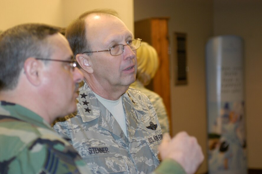 Chief Master Sgt. John Payne, 911th Airlift Wing command chief, discusses 911th Airlift Wing historical photos with Lt. Gen. Charles E. Stenner Jr., Chief of Air Force Reserve, Headquarters U.S. Air Force, Washington, D.C., and Commander, Air Force Reserve Command, Robins Air Force Base, Ga., during a base tour of the 911th AW, March 8, 2009. (photo by Staff Sgt Daniel Irwin)