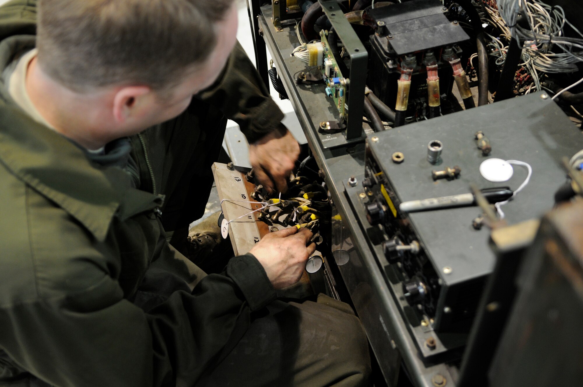 Tech. Sgt. Michael Ross removes a switch panel from a generator as part of a complete engine replacement on RAF Mildenhall March 23.  Sergeant Ross is part of the major repairs section who specializes in large scale repair projects.(U.S. Air Force photo by Senior Airman Christopher L. Ingersoll)