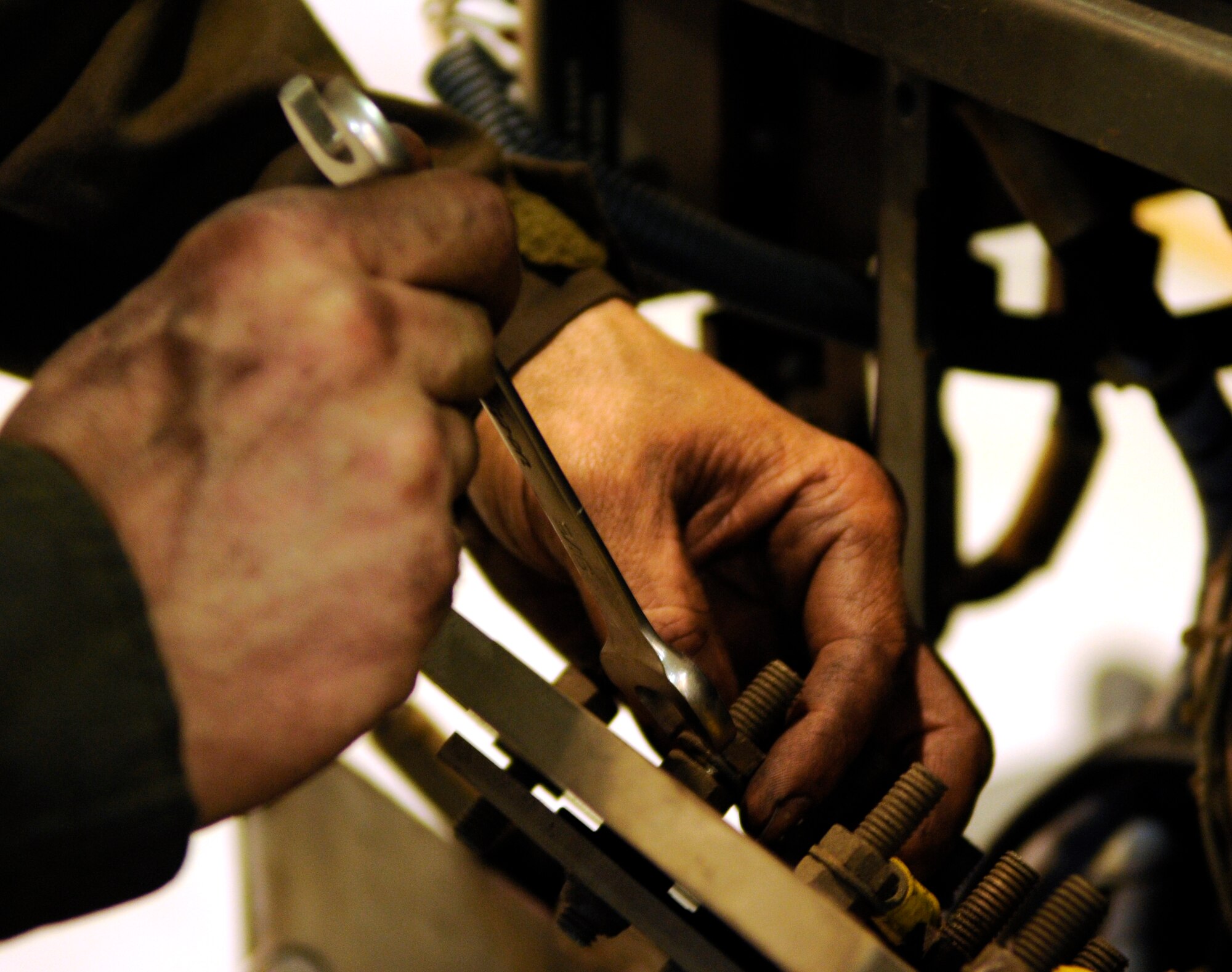 Tech. Sgt. Michael Ross of the 100th Maintenance Squadron Aircraft Ground Equipment flight removes and labels generator wires for a engine replacement on RAF Mildenhall, March 23.  Sergeant Ross is part of a three-man team working in the major repairs section of the AGE flight, whose responsibility is to perform all time intensive repairs on the ground equipment.  (U.S. Air Force photo by Senior Airman Christopher L. Ingersoll)