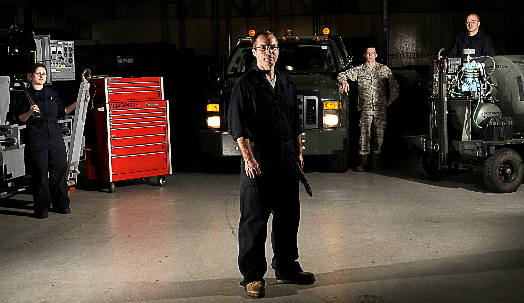 Members of the 100th Maintenance Squadron Aircraft Ground Equipment flight keep equipment functional and ready for mission use on RAF Mildenhall, March 23.  The duties of the AGE flight vary from general maintenance to major repairs such as engine replacements. (U.S. Air Force Illustrative photo by Senior Airman Christopher L. Ingersoll)