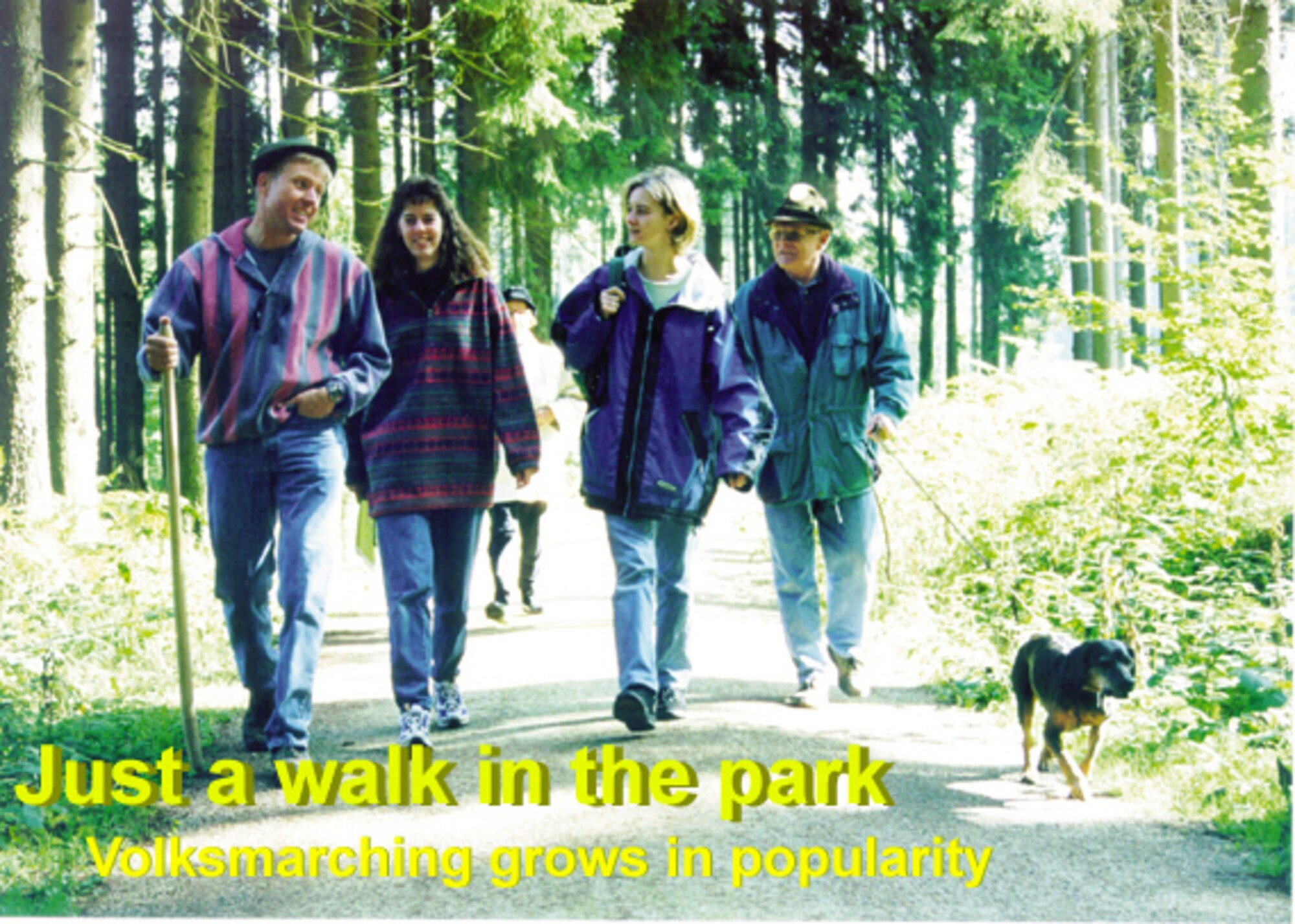 BINSFELD, Germany -- A group of volksmarchers enjoys the first rays of sunshine during a march through the Binsfeld forest. Volksmarches follow a circular route starting and ending at the same clubhouse, tent or community center. The customary sign-up fee is 2-3 euros. (Photo by Iris Reiff)