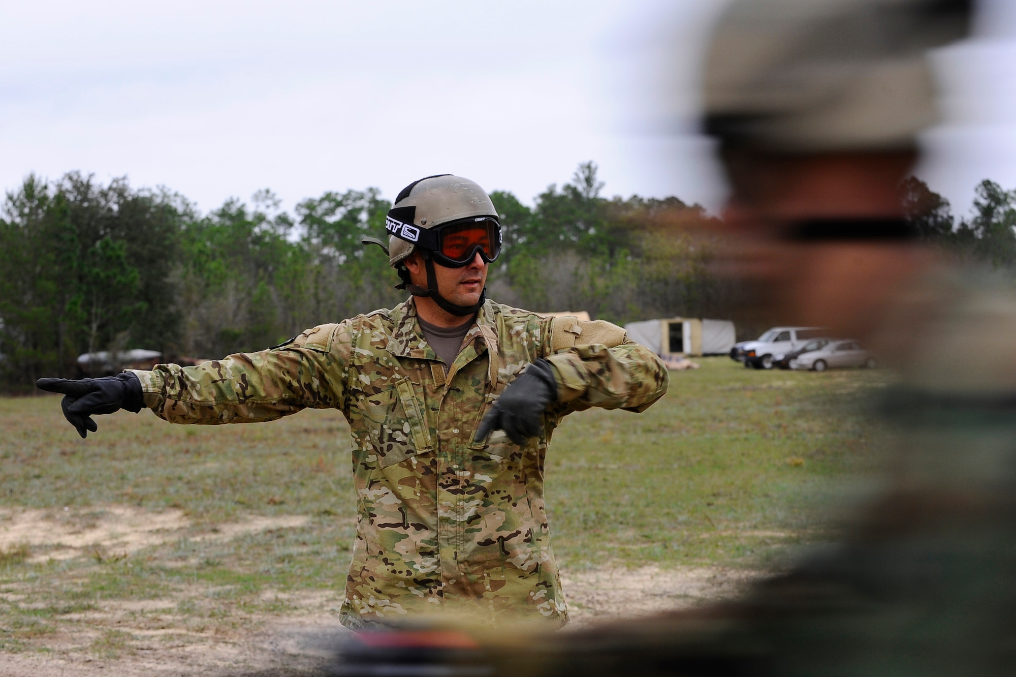 HURLBURT FIELD, Fla. -- An instructor directs students from the 720th Special Tactics Training Squadron to enter a smaller inner circle as they speed by during a beginner level dirt bike course here, March 31. By redirecting the flow of bikes, the instructors test the student's ability to keep their eyes forward and ready for any sudden change in direction. (U.S. Air Force photo/ Senior Airman Julianne Showalter)(RELEASED)