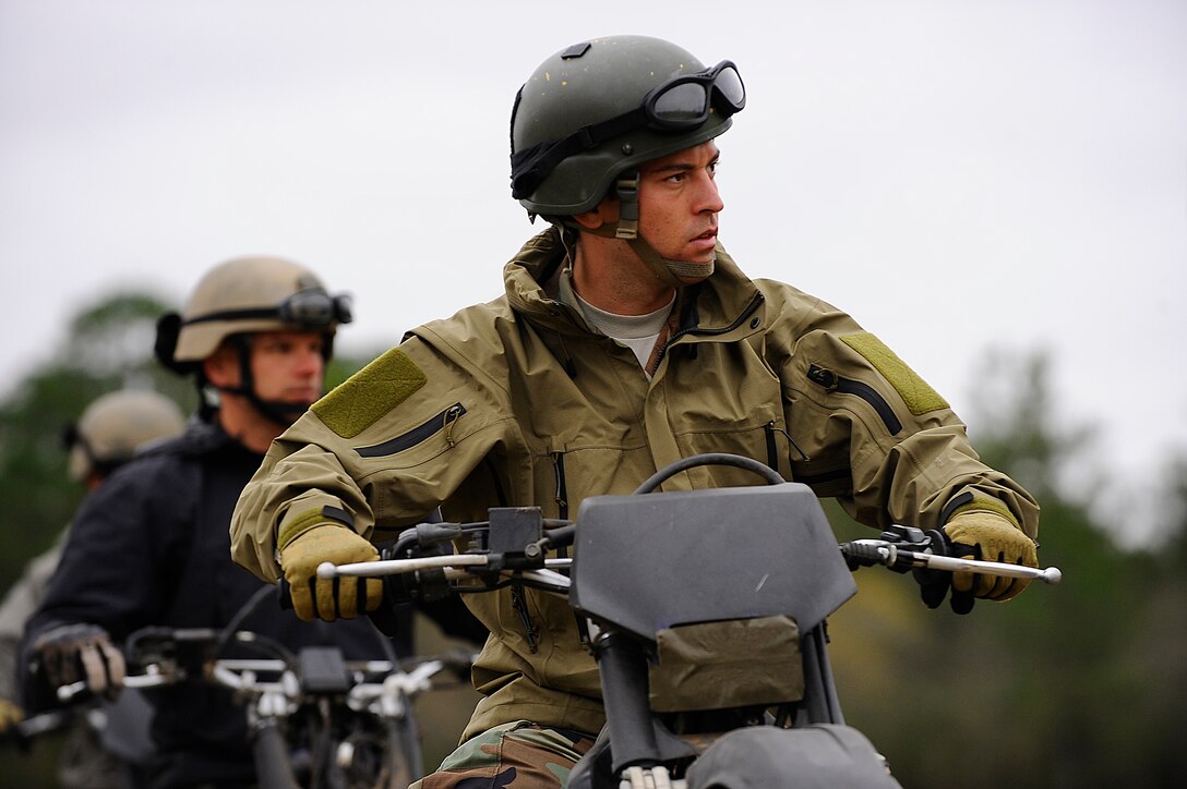 HURLBURT FIELD, Fla. -- A student from the 720th Special Tactics Training Squadron listens to safety instructions given during a beginner level dirt bike course here, March 31.  The course prepares them for obstacles they may face and gives them situational awareness to drive safely. (U.S. Air Force photo/ Senior Airman Julianne Showalter)(RELEASED)