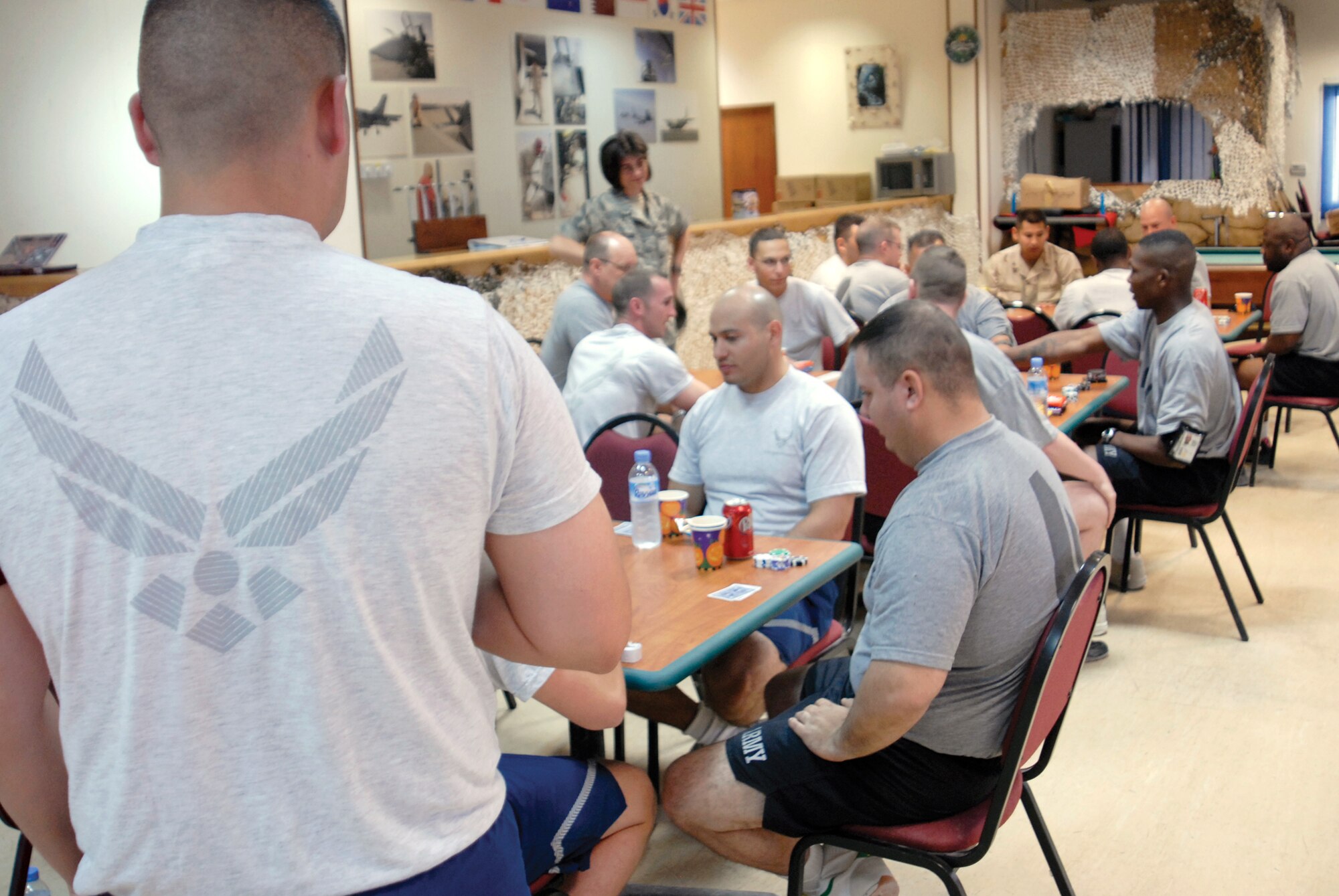 Servicemembers receiving treatment in the In-Theater Care Program participate in a card game activity coordinated by the Airman Readiness Center staff, March 22, 2009, in an undisclosed location in Southwest Asia. The ARC staff and volunteers coordinate regular activities for injured servicemembers as part of the program. (U.S. Air Force photo by Senior Airman Andrew Satran/Released)