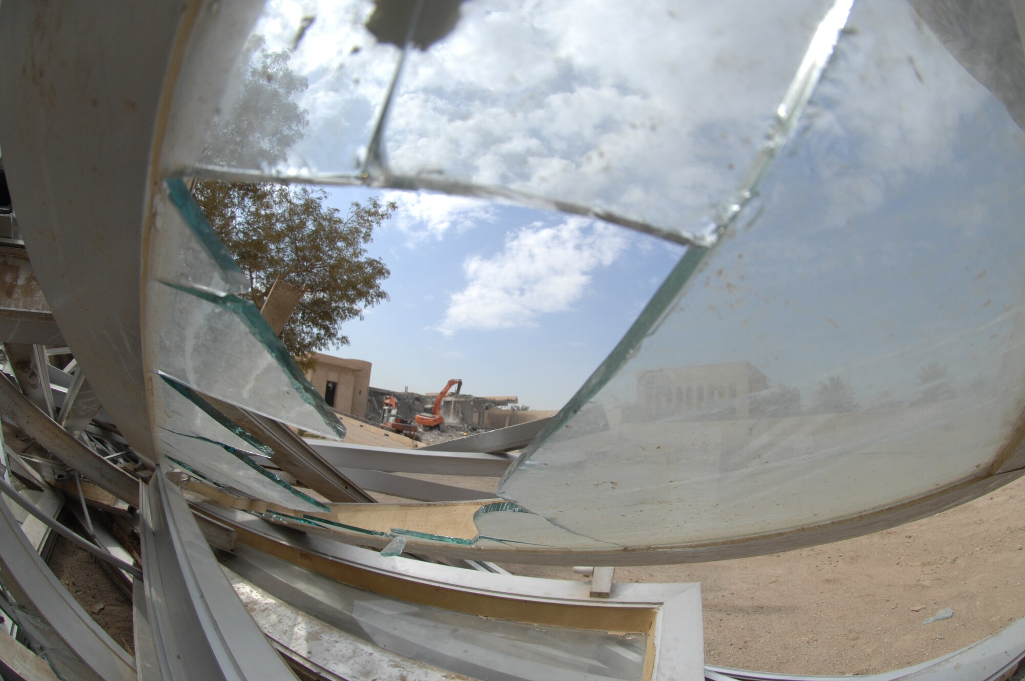 An Iraqi contractor demolishes one of the three villas once belonging to bath party members. The villas are now being demolished to make room for a new foreign embassy. The demolition, which should be complete by mid April, is a project for the First Iraqi Construction Company. (U.S. Air Force photo by Staff Sgt. Tim Beckham)