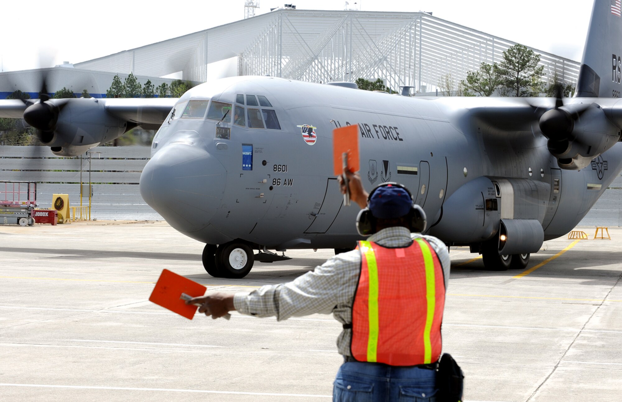 Tail number 8601, the first of 14 C-130J Super Hercules aircraft bound for Ramstein Air Base over the next 12 months, is marshaled to the runway Monday to depart the Lockheed Martin Aeronautical Plant in Marietta, Ga. The brand-new J-model is scheduled to land on-station at Ramstein during an arrival ceremony beginning at 3 p.m., Apr. 7, at Ramstein’s Ramp 1. (Photo courtesy Lockheed Martin)