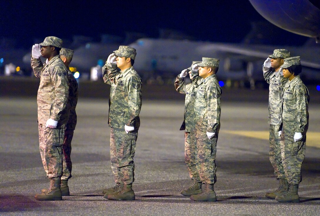 U.S. Air Force airmen transfer the remains of Air Force Staff Sgt. Phillip A. Myers on Dover Air Force Base, Del., April 5, 2009. This was the first time the Defense Department has allowed families to permit media coverage of dignified transfer operations under a new policy.